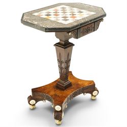 Early 19th century Anglo-Indian rosewood and specimen marble chess table, the octagonal top inset with a chequerboard of various coloured marbles within a broad fossil marble border and black marble edge, over a foliate and rosette carved frieze and turned-and-tapering pedestal with lotus-carved decoration, on a concave-sided quadripartite platform base with anthemion carved scroll terminals, inset ivory roundels and brass bun feet