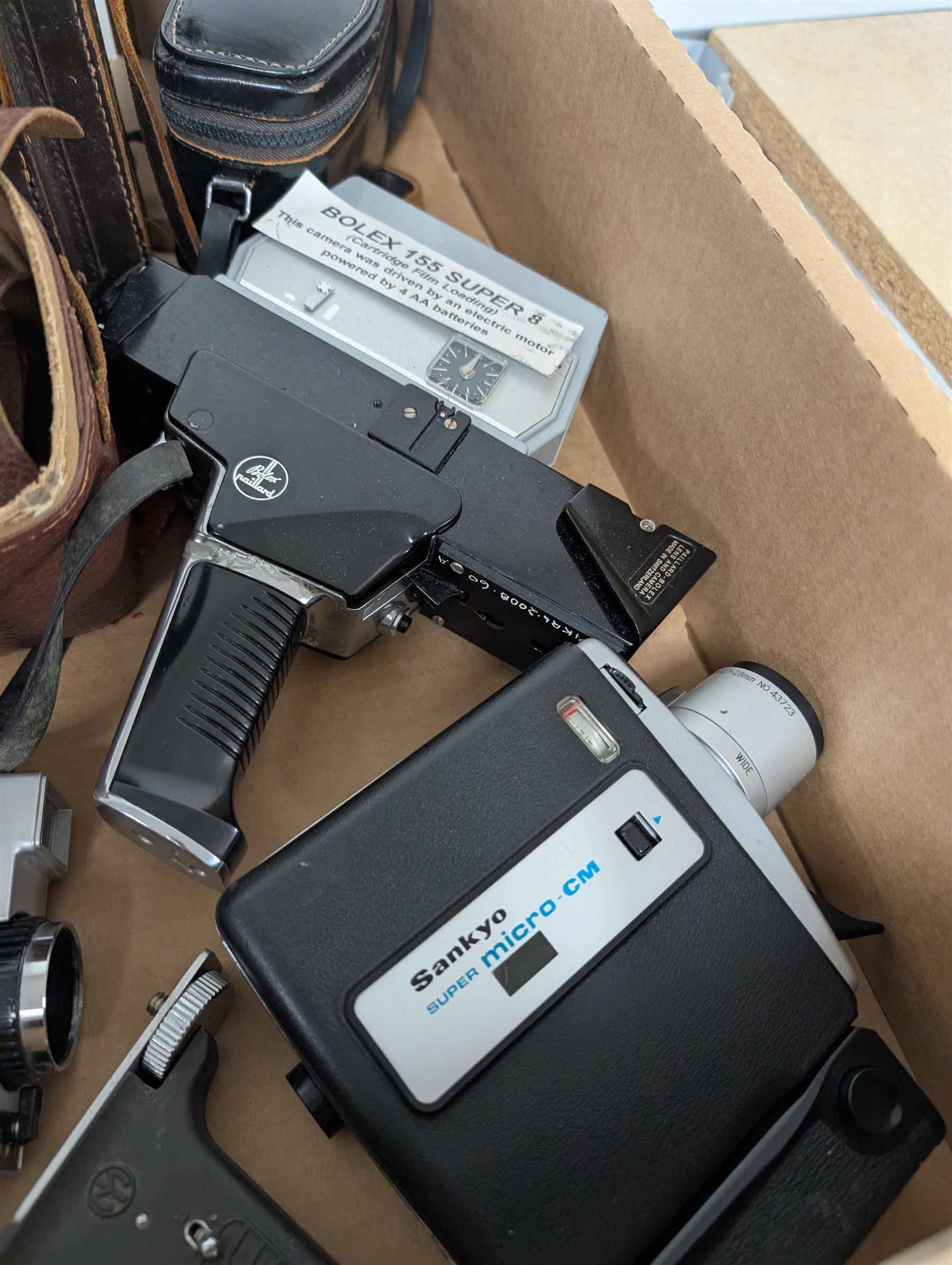 Collection of vintage cine cameras, including Bolex Paillard B8L, Mansfield Holiday Meter Matic, Quarz, Bell & Howell Autoset, Sankyo Super Micro, Canon Demi C, Agfa Movexoom, etc