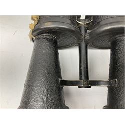 Pair of WWII German U-boat binoculars probably 7 x 50 by Leitz, with rubber eye piece protector covers and leather case stamped with Kriegsmarine mark to the lid and dated 1944, with leather strap.