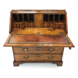  Queen Anne style style walnut double dome top bureau bookcase, two astragal glazed doors with adjustable shelves and candle slides, fall front with inset leather writing surface and fitted interior above three frieze, two short and two long drawers with brass handles, on bracket feet,  H220cm, W102cm, D56cm  