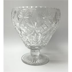 A cut glass centre piece bowl, of tapering form upon short thick stem and circular foot with star cut base, H23cm D20cm.