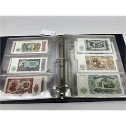 World banknotes, including Queen Elizabeth II The States of Jersey one pound 'DB202703', five pounds 'BB527762' and ten pounds 'AB651481', reserve bank of New Zealand two dollars '1L3 741894', King George V Straits Settlements one dollar 1st January 1935 'F/83 28924', various Bank of England notes etc, housed in two ring binder albums