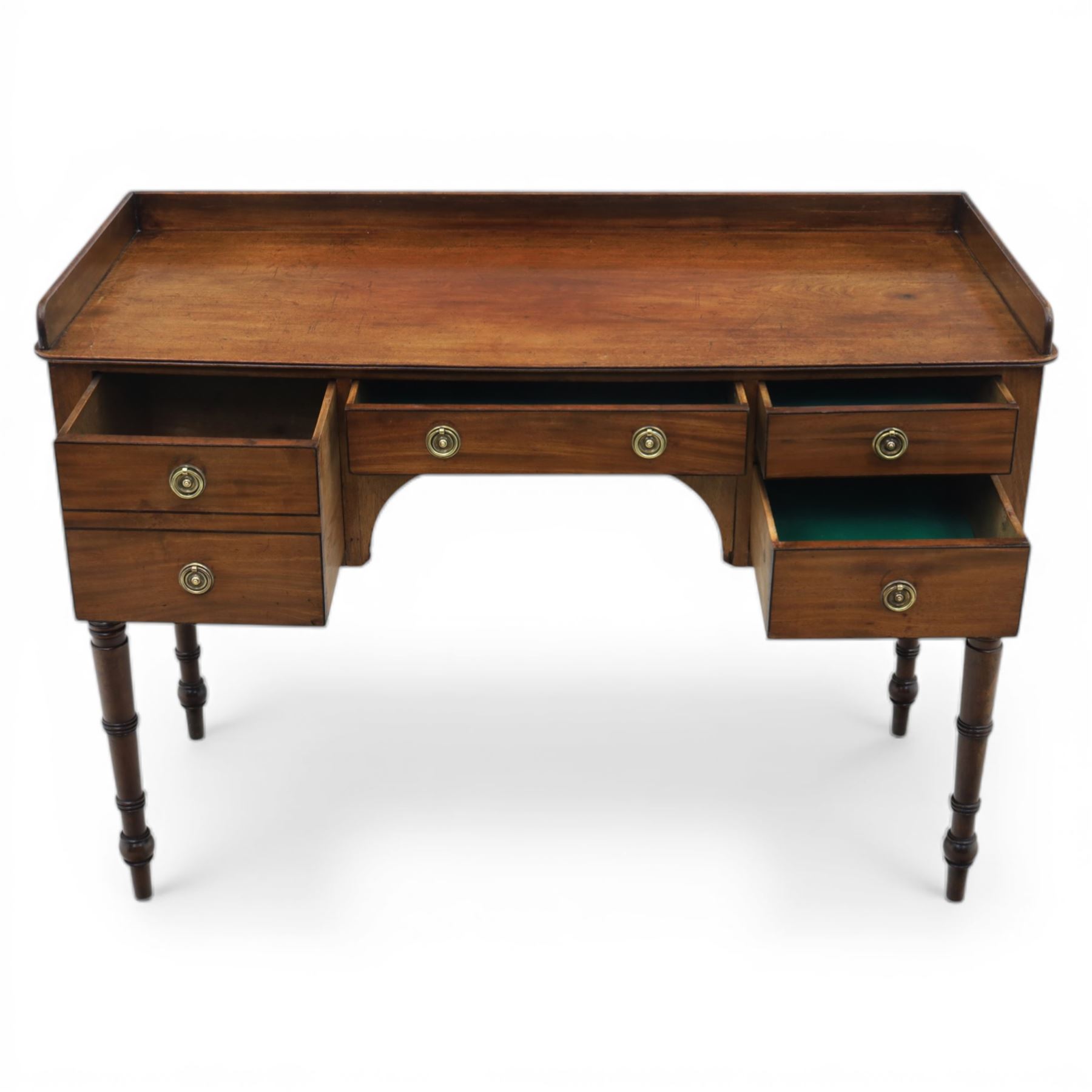 Late Georgian mahogany sideboard, circa 1820, the rectangular top with gallery, above an arrangement of four drawers with brass ring handles, one double height drawer to the left, a central single frieze drawer, and two drawers to the right, upon turned legs