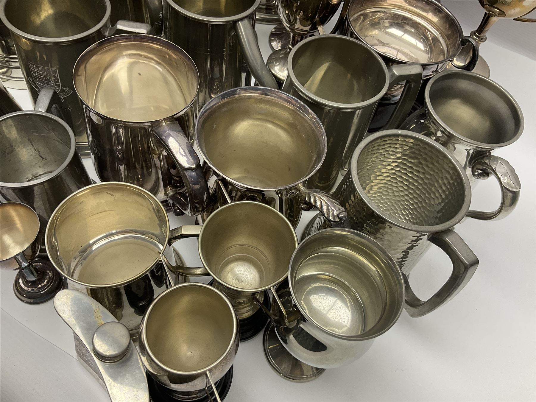 Collection of pewter and silver-plated trophy cups and presentation tankards, largest H28cm
