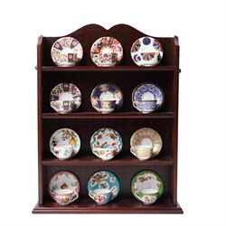 Royal Worcester miniature cups & saucers collection, 1993,  various patterns on display sh...