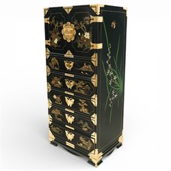 Japanese Shibayama style black lacquered curio chest, cupboard doors enclosing four short over two long fitted drawers, decorated in gilt with birds, flowers and landscape scenes, raised on gilt mounted bracket feet