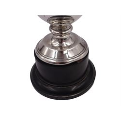 1920s silver trophy cup, with angular twin handles, upon knopped stem with circular spreading foot, the body with presentation engraving 'Burniston & District Show, presented by S Fox Linton TD MD, for the Best Agricultural Mare or Gelding, 10 miles radius, 1928' and engraved with winners verso, hallmarked Charles Boyton & Son 1921, upon black plastic base, including base 25cm