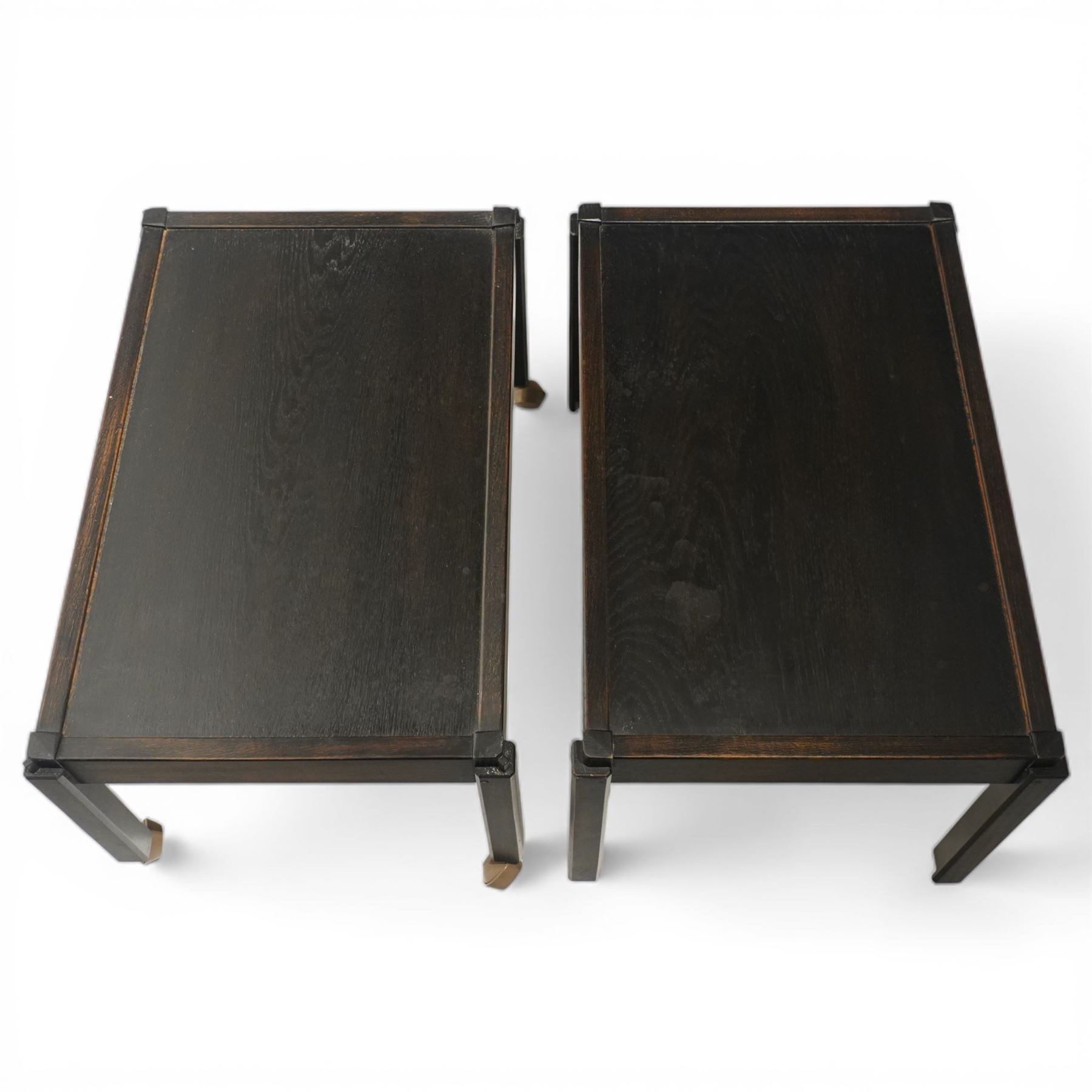 Acornman - dark stained oak two-tier stacking tea trolley, the rectangular removable top, above a second tier raised on castors, with carved acorn signature, by the workshop of Alan Grainger of Brandsby