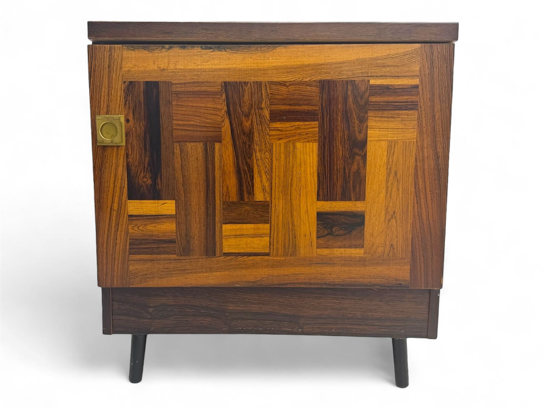 Troeds of Sweden - mid-20th century rosewood veneered cupboard, single door with brass handle enclosing interior fitted with one drawer, raised on ebonised tapered and splayed supports