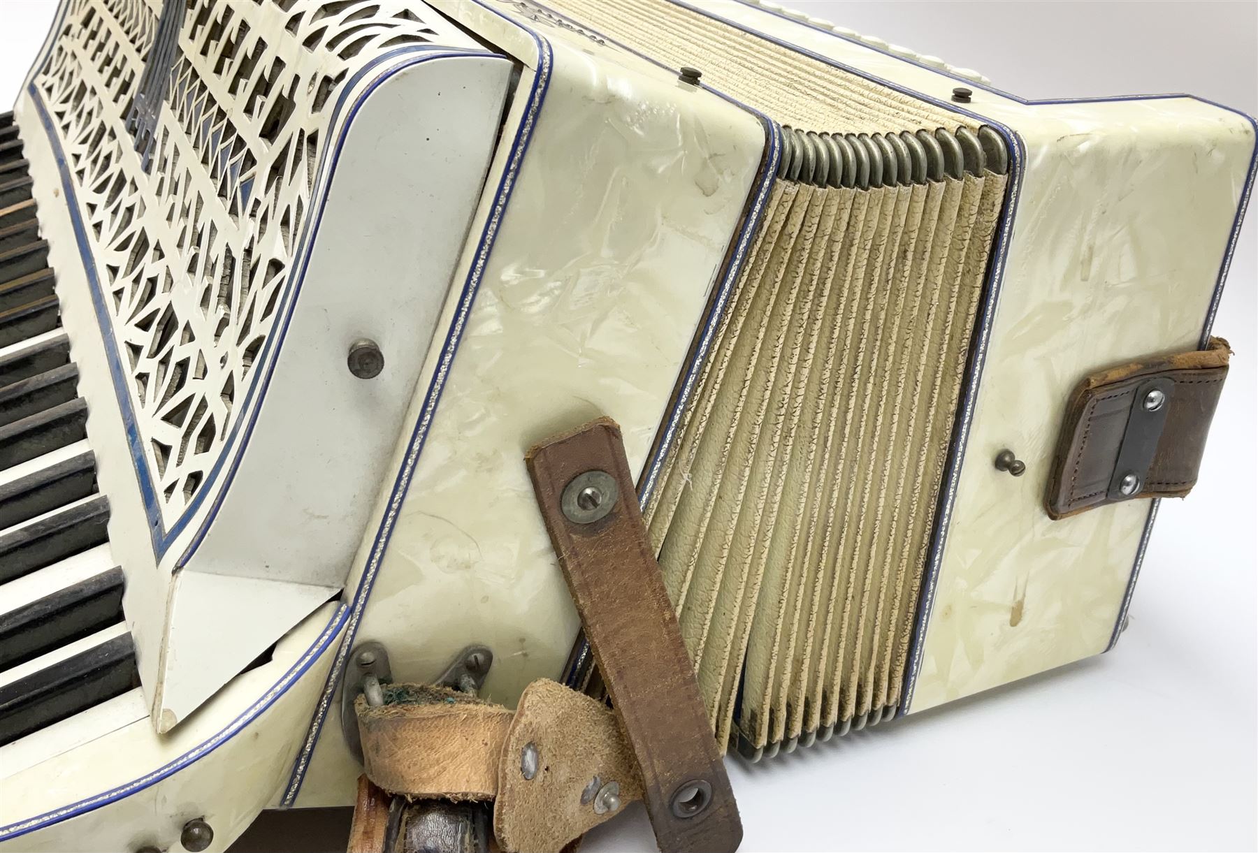 Italian Lambardi piano accordion in ivory coloured pearline case with jewelled decoration, twenty keys and one-hundred and twenty buttons L 37cm