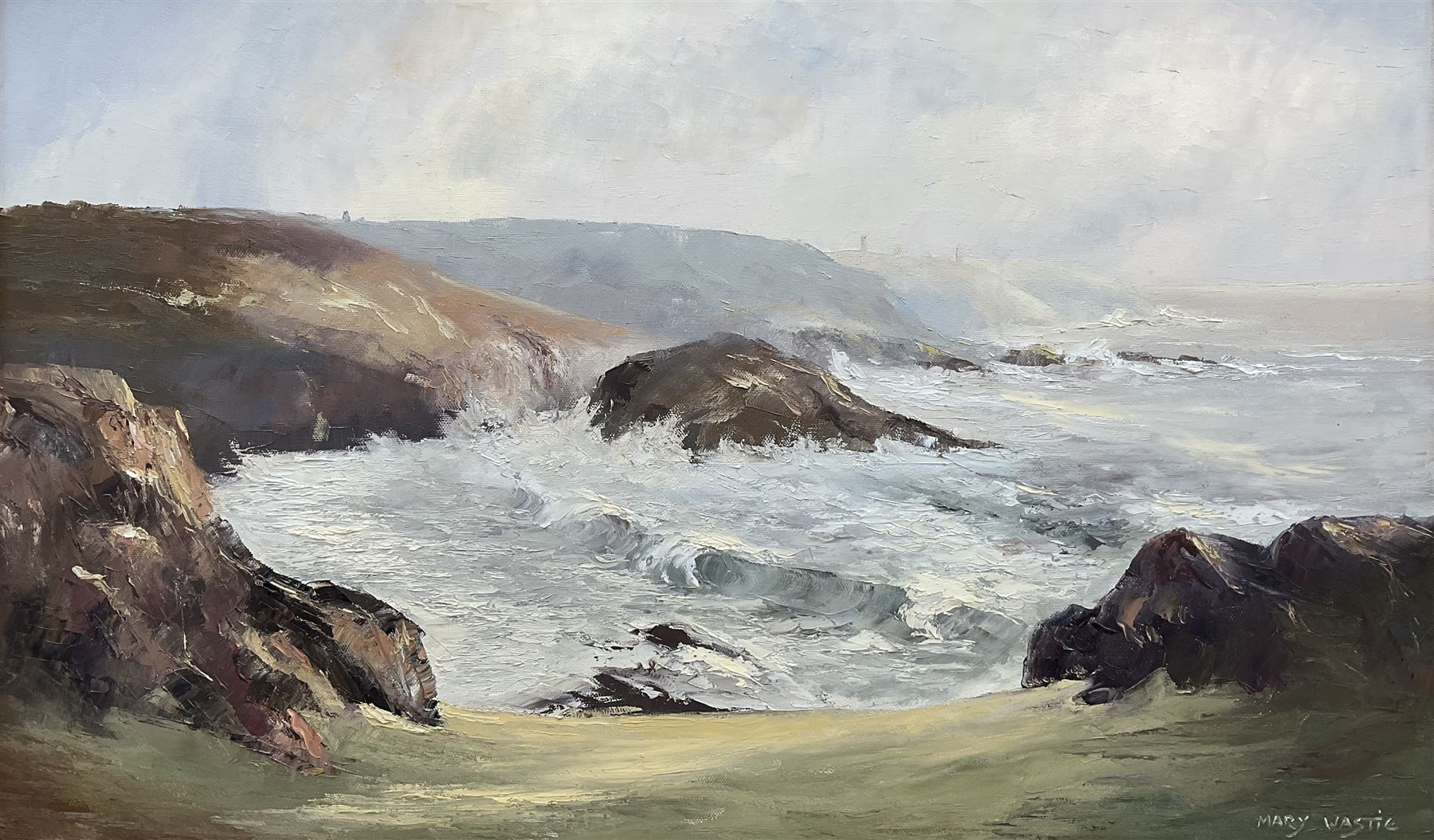 Mary Wastie (Cornish 1935-): Rocky Seascape near Pendeen, oil on canvas signed 39cm x 65cm 