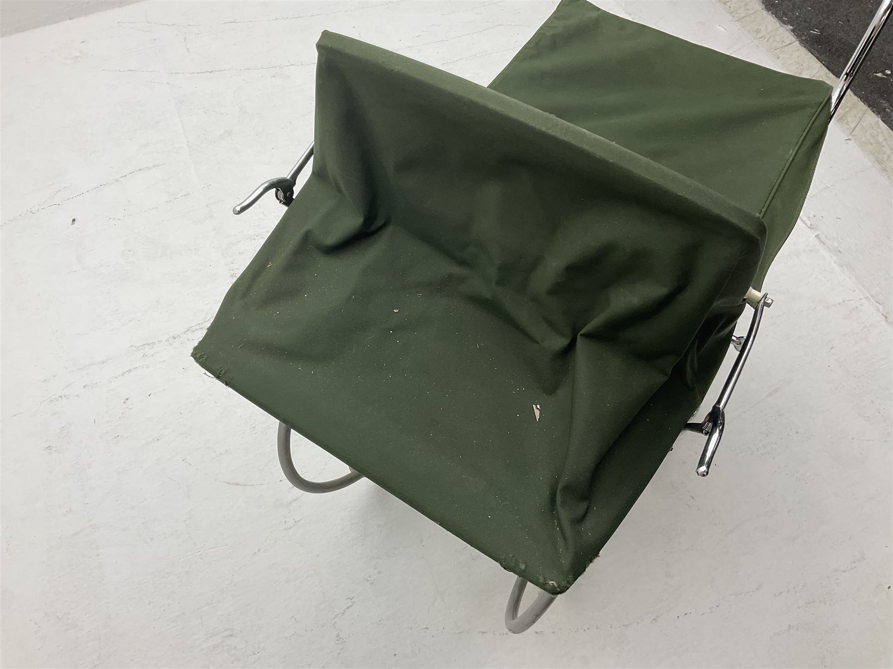 Silver Cross coach-built doll's pram with green fold-down hood and cover, sprung tubular frame, chrome and white handle, four spoked wheels with brake, mattress, pillow and bedding L97cm