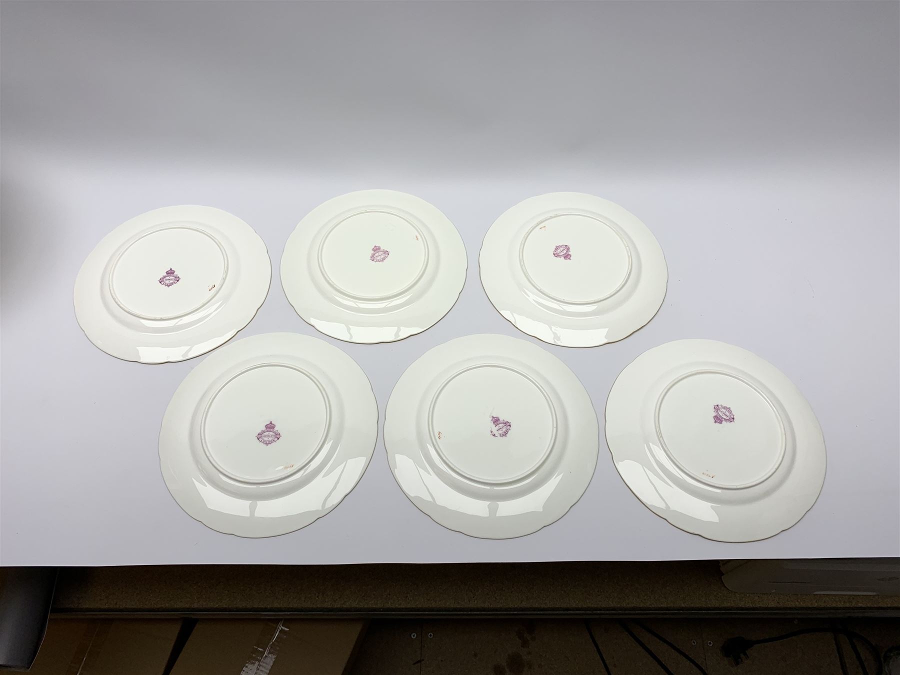 19th century Minton dessert service, comprising four comports, one tazza, and twelve plates, each hand painted with birds perched upon branches, and further detailed with insects and heightened in gilt, with printed retailers mark beneath for John Mortlock Oxford Street London, and impressed Minton mark to most, comport H13.5cm, plates D23.5cm. 
