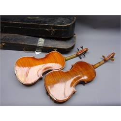  Early 20th century continental violin with 35cm two-piece maple back and ribs and spruce top, L58cm overall, in ebonised wooden carrying case with bow, another similar part violin in ebonised wooden case with bow, two tailpieces and chin rest  