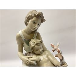 Lladro figure, Where Love Begins, modelled as a mother of child feeding birds, on a mahogany base, limited edition 3413/4000, with original box, no 7649, year issued 1995, year retired 1996, H36cm 