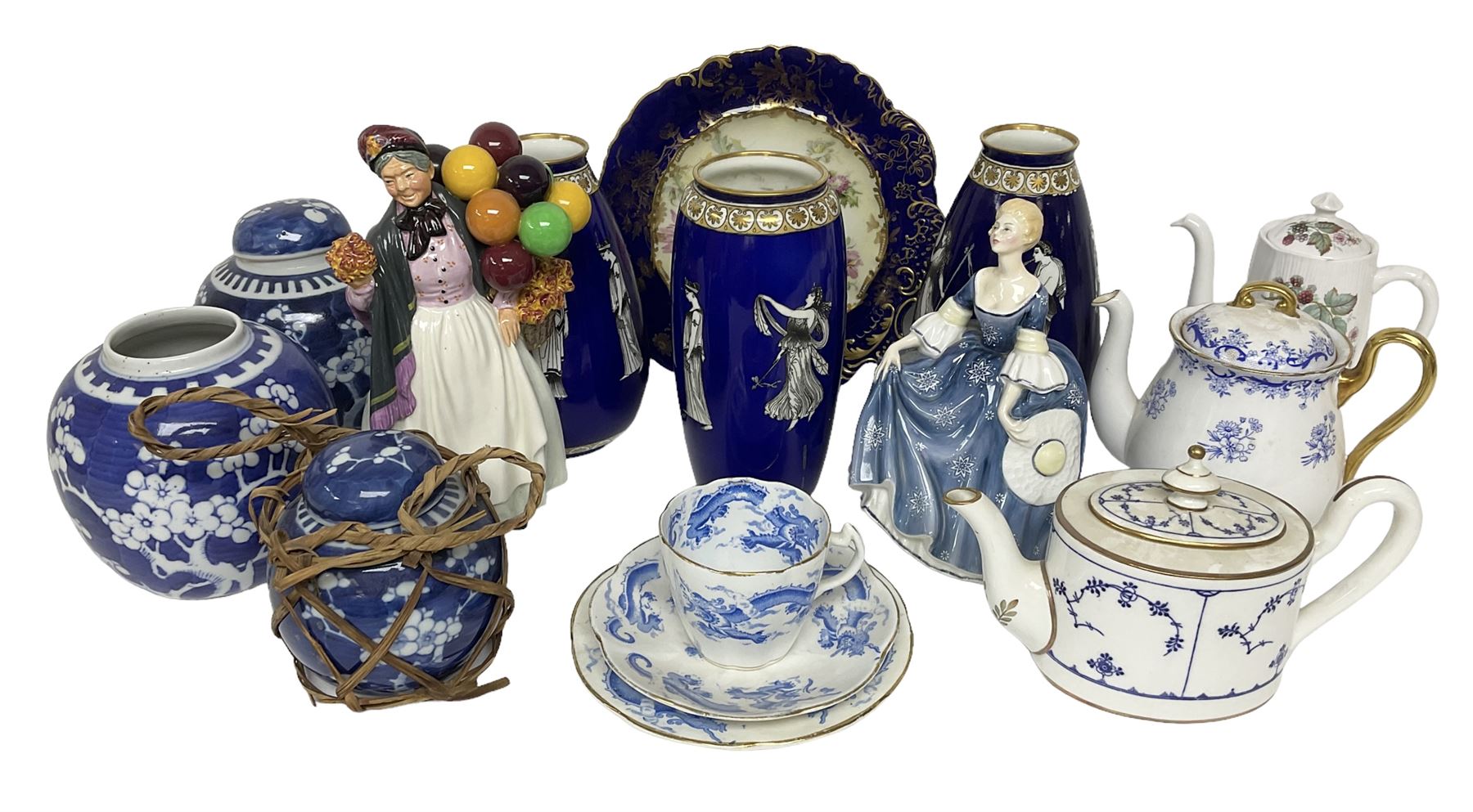  Mintons teapot of oval form, circa 1900, decorated in blue with foliate sprigging within gilt borders upon white ground, Shelley Heavenly Blue teapot, together with another Shelley teapot decorated with berries and foliage, two Royal Doulton figures comprising Biddy Penny Farthing HN1843 and Hilary HN2335, pair of Spode's New Stone plates, etc