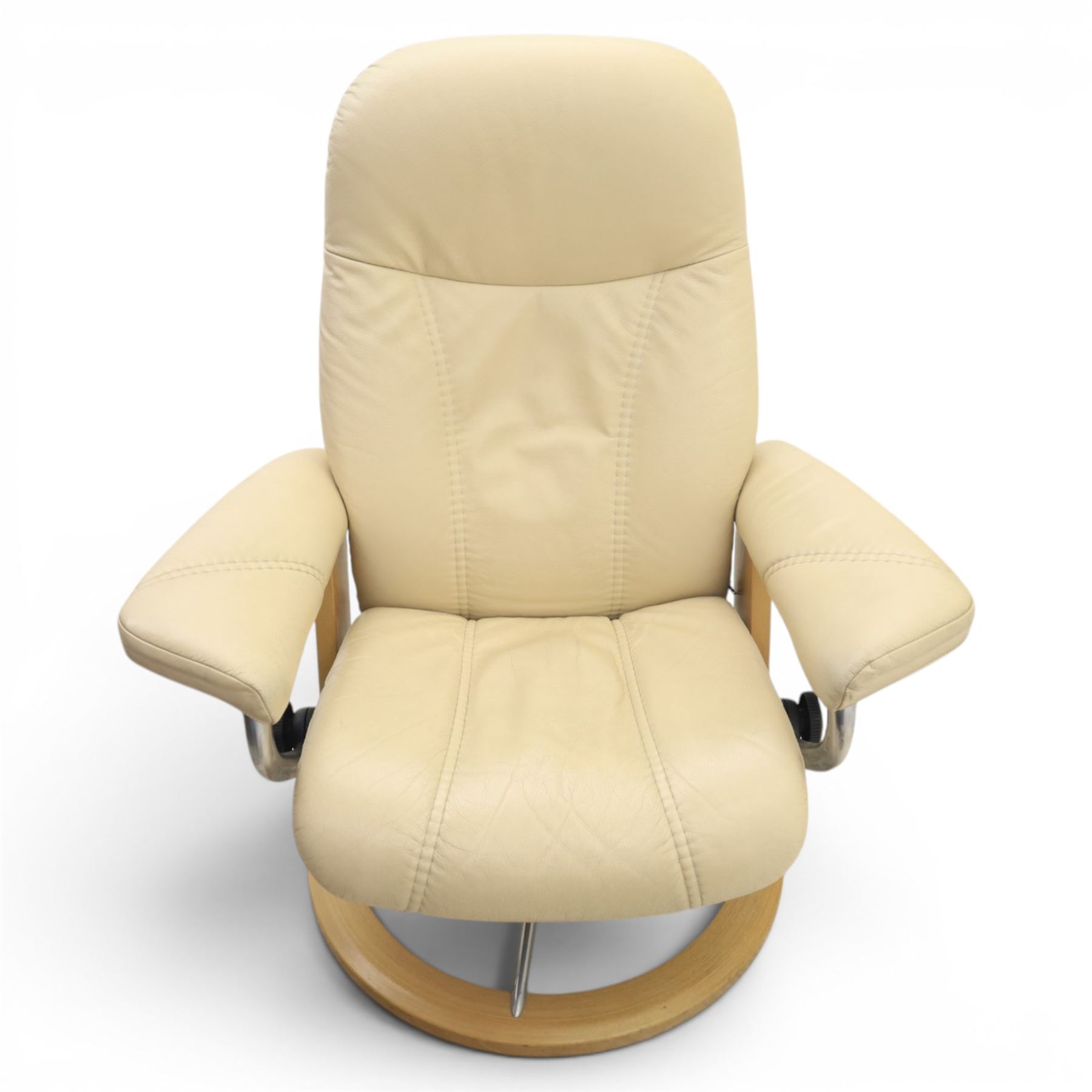 Ekornes - Stressless reclining beige leather armchair and stool, raised on brushed steel frame, light oak rotating base