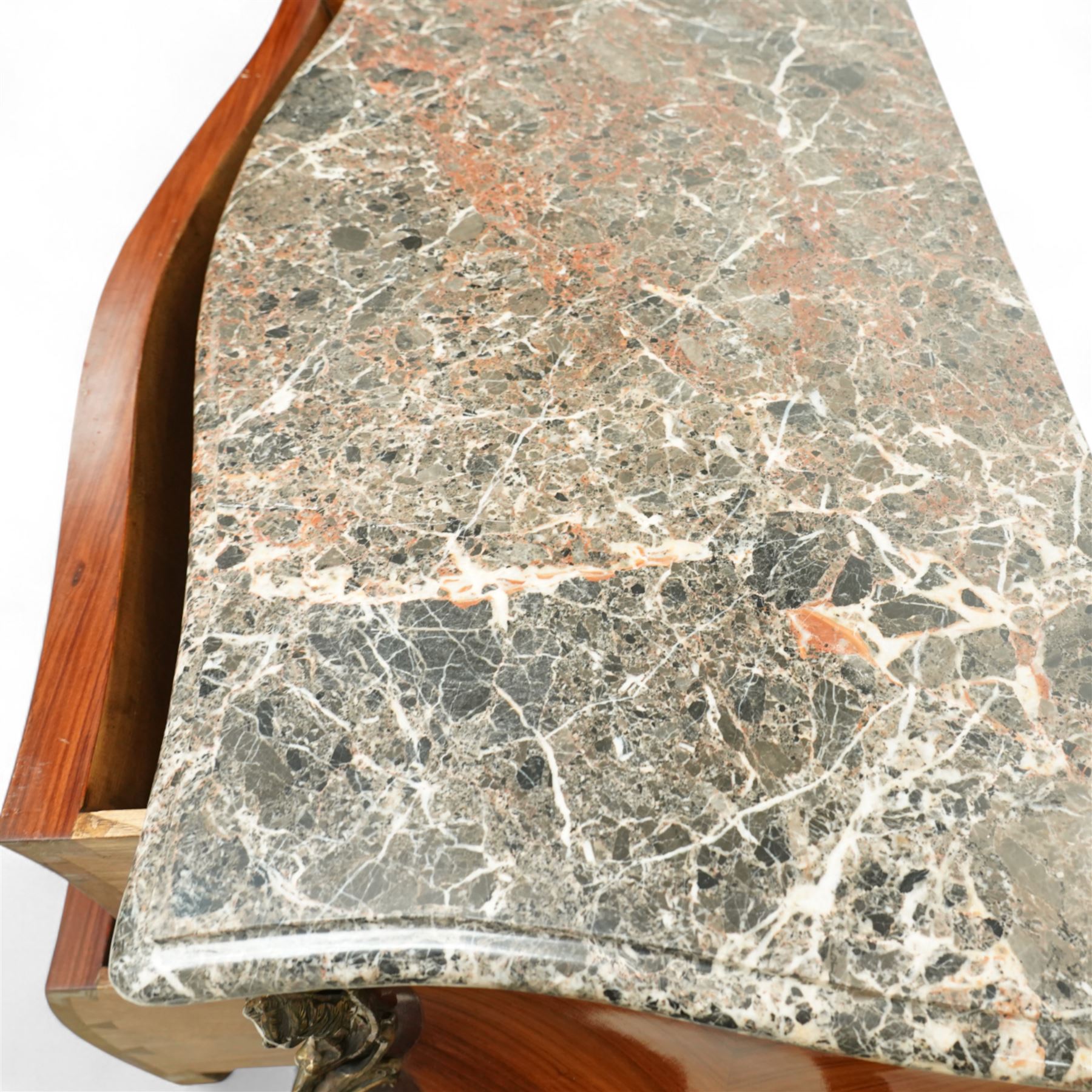 French Louis XV revival bombe commode, early 20th century, with variegated marble top above two drawers inlaid with floral marquetry, gilt metal rococo handles and mounts, kingwood and tulipwood veneers laid in chevron and quartered patterns, on cabriole supports with gilt sabots