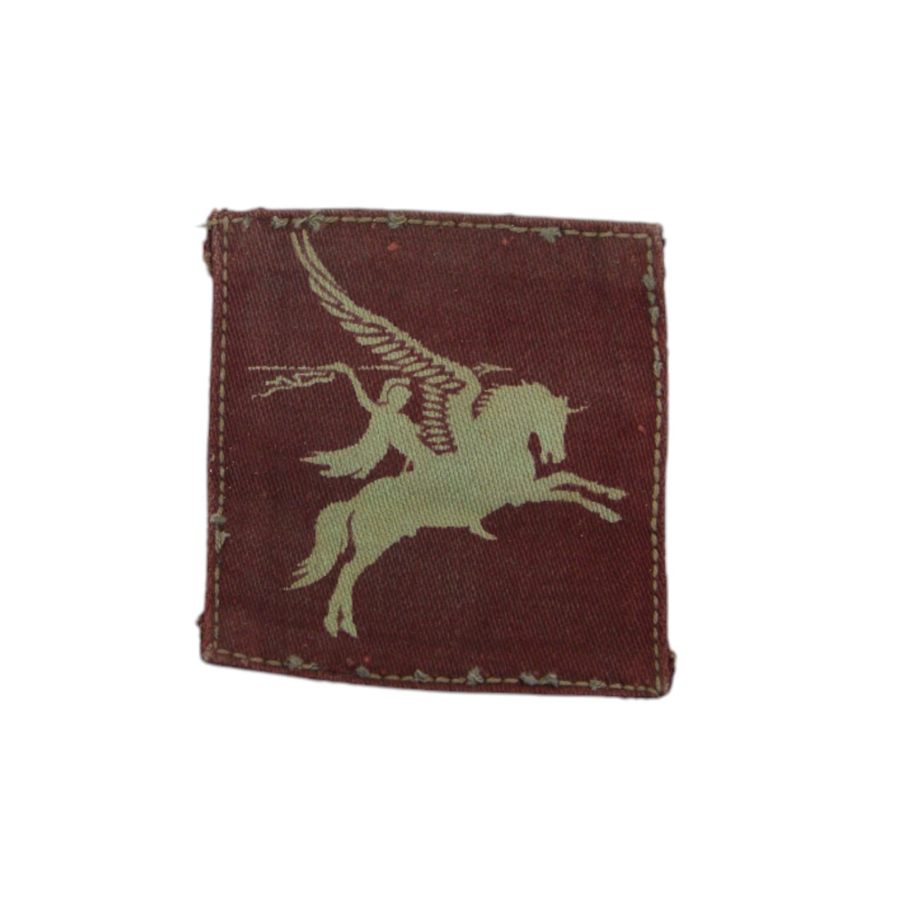 WWII Parachute Regiment insignias, comprising two shoulder titles, Pegasus formation badge, cloth wings and cap badge 