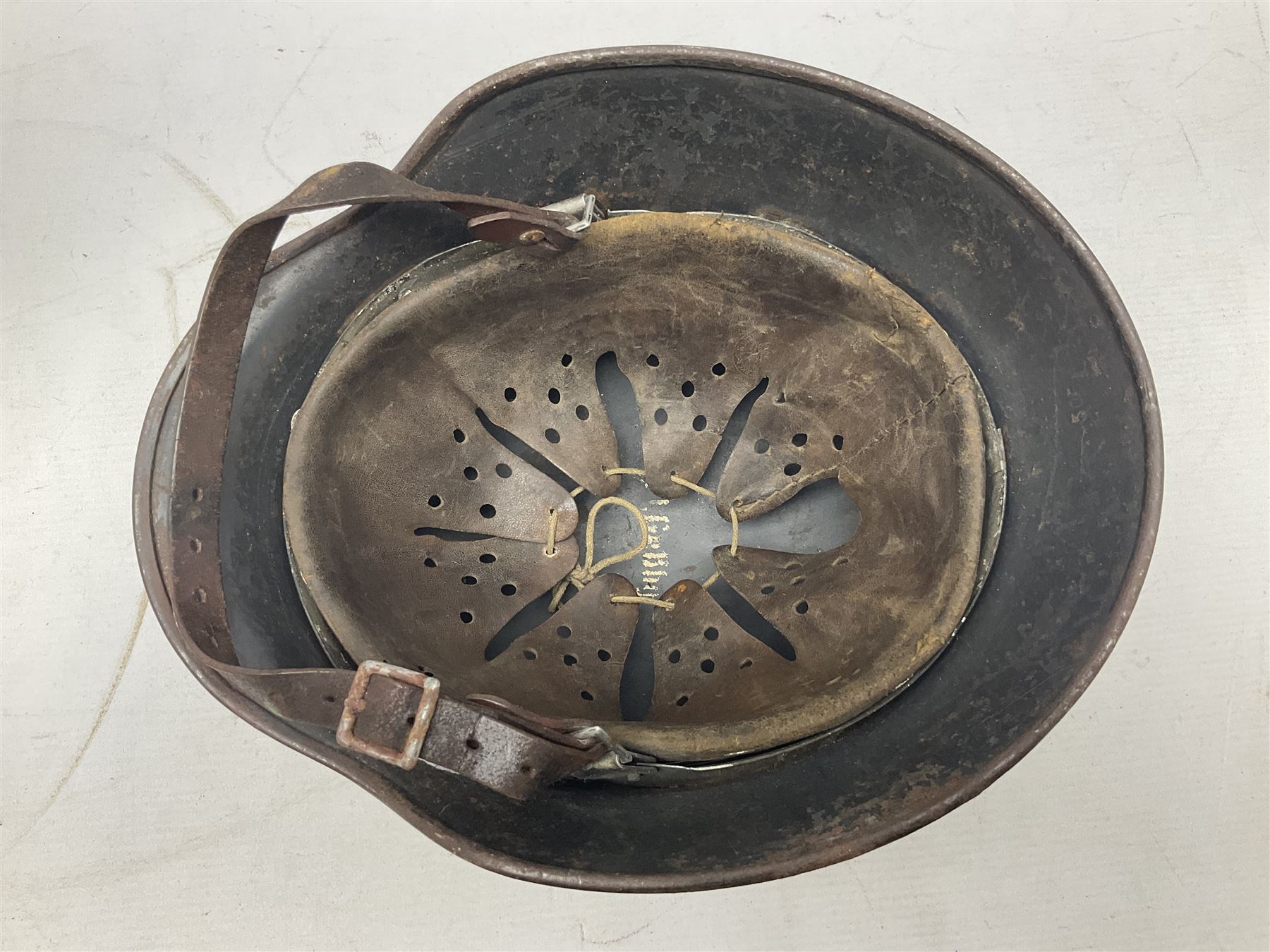 WW2 German Luftwaffe M40 double decal steel helmet with liner and chin strap; impressed 506 to back skirt; indistinct stencil type name(?) to inside
