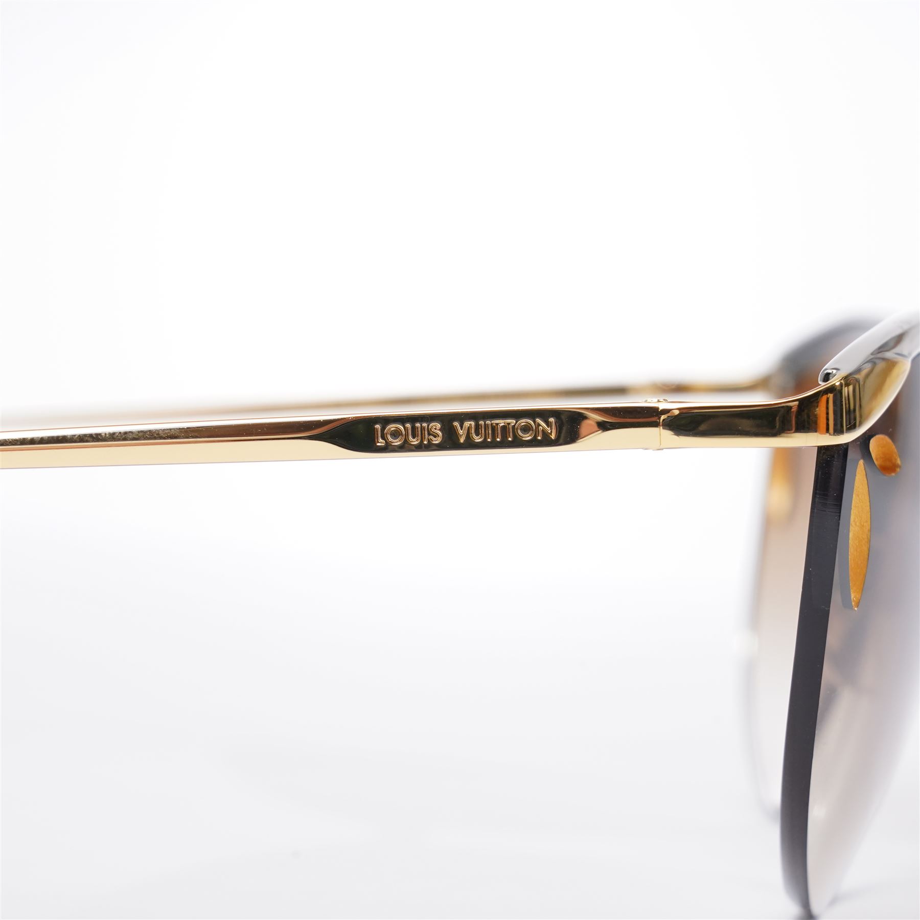 Louis Vuitton - pair of half-rim sunglasses, with gradient tinted lenses with pierced corners, silver and gold-tone frame, the temples signed ‘Louis Vuitton’, unused with original pouch, leather box, booklet and outer box