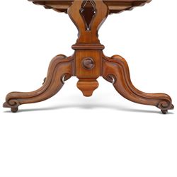 Victorian mahogany breakfast table, oval moulded top over a shaped frieze, on twin pierced lyre-form end supports with moulded scroll feet, united by a turned stretcher, on castors
