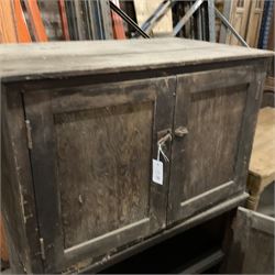 Two early 20th century pine cupboards, enclosed by panelled doors, each fitted with shelf and drawers  - THIS LOT IS TO BE COLLECTED BY APPOINTMENT FROM THE OLD BUFFER DEPOT, MELBOURNE PLACE, SOWERBY, THIRSK, YO7 1QY