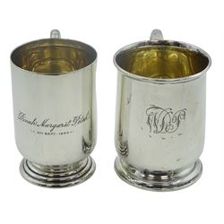 Two George V silver christening mugs, each of plain cylindrical form upon a circular stepped foot, one example with engraved monogram, the other with dedication, hallmarked Collingwood & Sons Ltd, Birmingham 1910, and 1919, approximate total weight 7.71 ozt (240 grams)