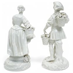 Pair of 19th century Berlin blanc de chine figures of flower sellers on circular bases H25cm and a figure group of mother and child (3)