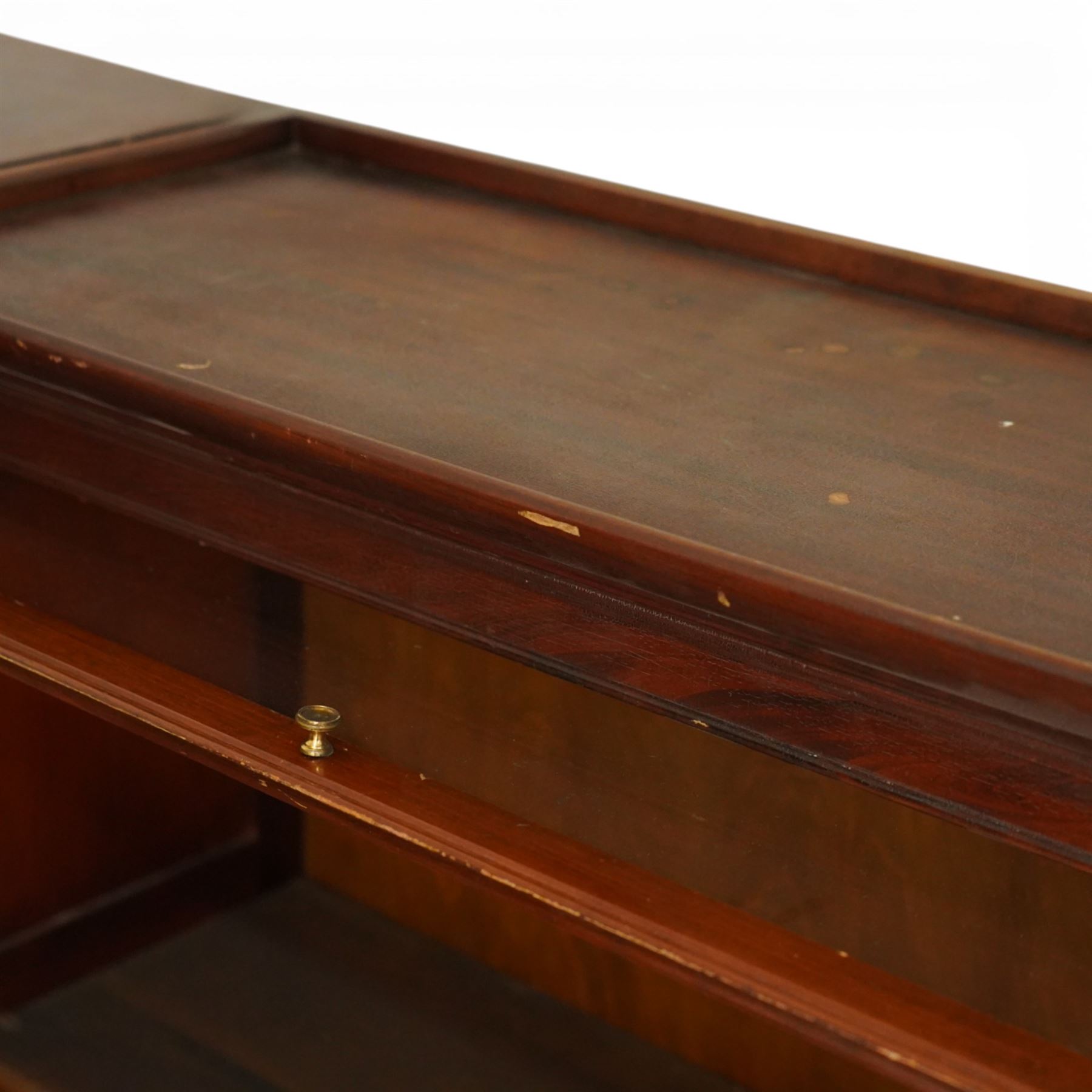 Globe Wernicke - early 20th century corner bookcase, comprising six sections, panelled sides raised on a moulded plinth base  