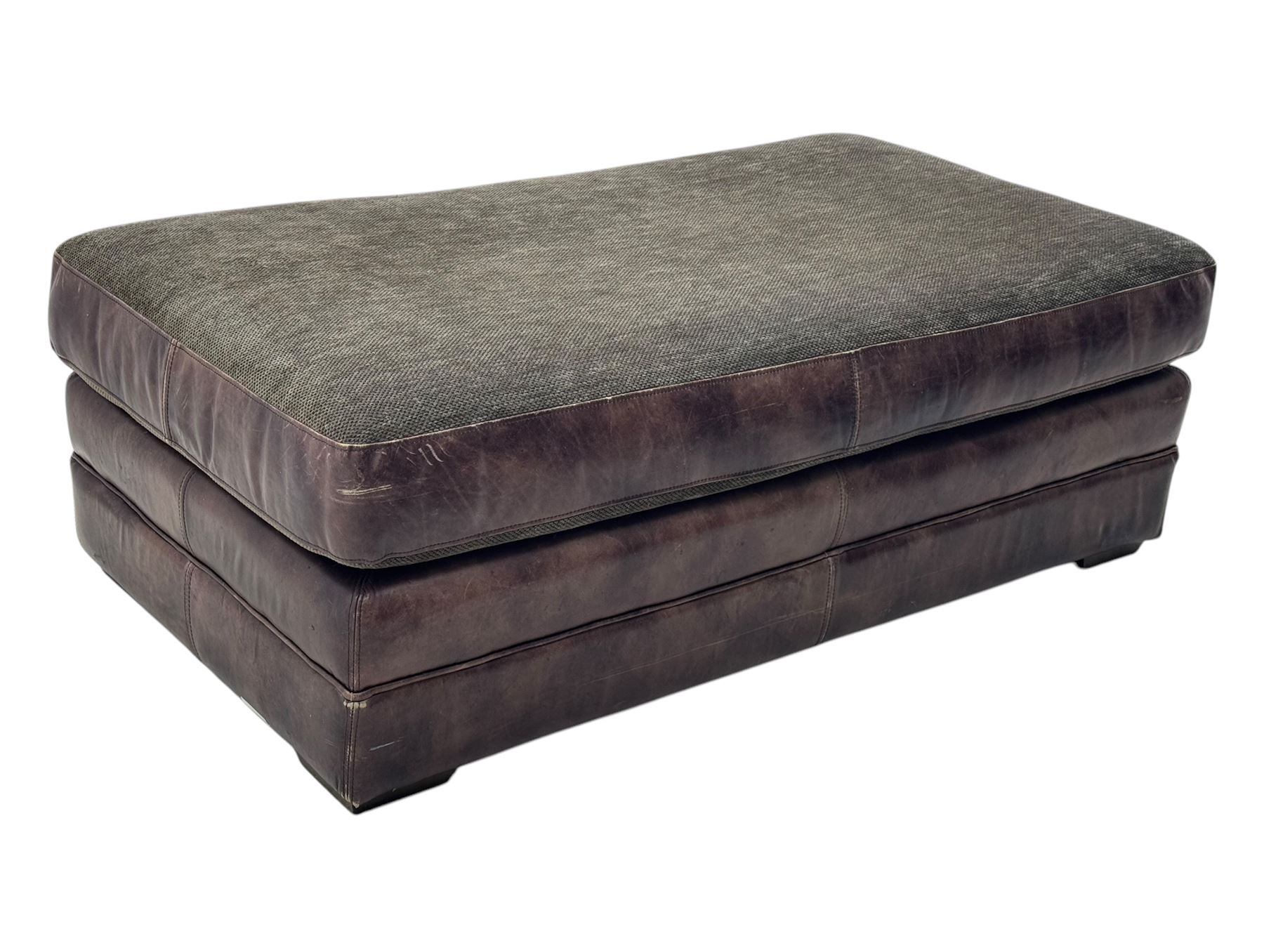 Large Knole design three-seat sofa upholstered in brown leather with scatter cushions upholstered in contrasting striped and Union Jack patterned fabric, on block feet (W210cm, H100cm, D102cm); together with matching rectangular footstool (135cm x 75cm, H45cm)