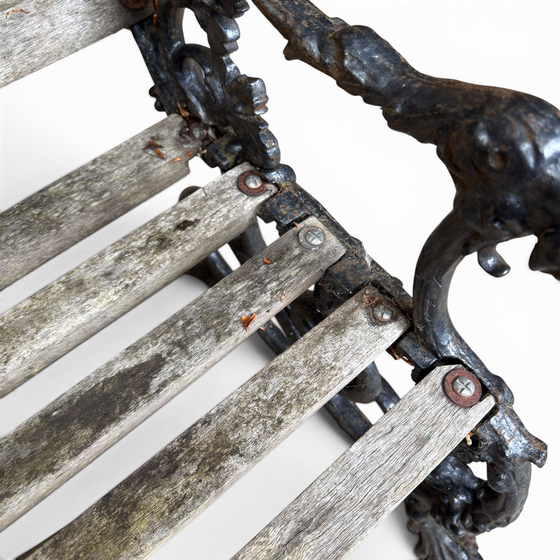Victorian revival Coalbrookdale 'Dog and Serpent' pattern heavy cast iron garden bench, grape vine detail, joined with eight hardwood slats, finished in black paint