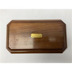 19th century mahogany tea caddy, of sarcophagus form with canted corners, the hinged cover with inset vacant brass panel, opening to reveal a twin compartmented interior with square covers above zinc lined divisions, H11cm W23cm D13cm