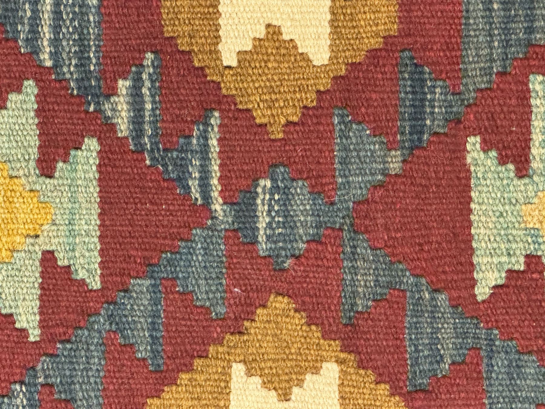 Maimana Kilim ground runner, multicoloured geometric medallions arranged in rows, with triangular motifs in the field, the wide border in brown with contrasting guard bands