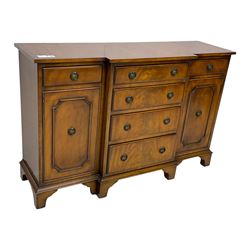 Georgian design mahogany break-front sideboard, fitted with six drawers and two cupboards, on bracket feet 