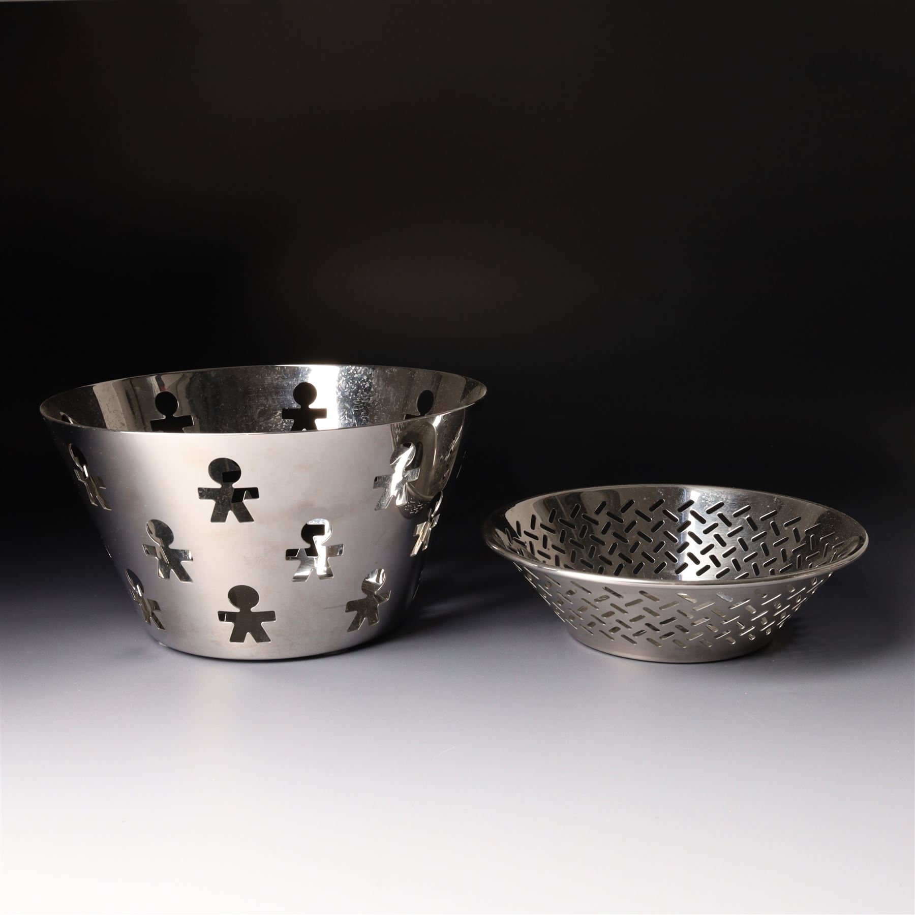 Collection of Alessi items, comprising a 'Juicy Salif' lemon squeezer designed by Philippe Starck, a condiment set designed by Ettore Sottsass, two 'Carlo - a ghost on top of a bottle' designed by Mattia Di Rosa, and further items, all stamped (10)