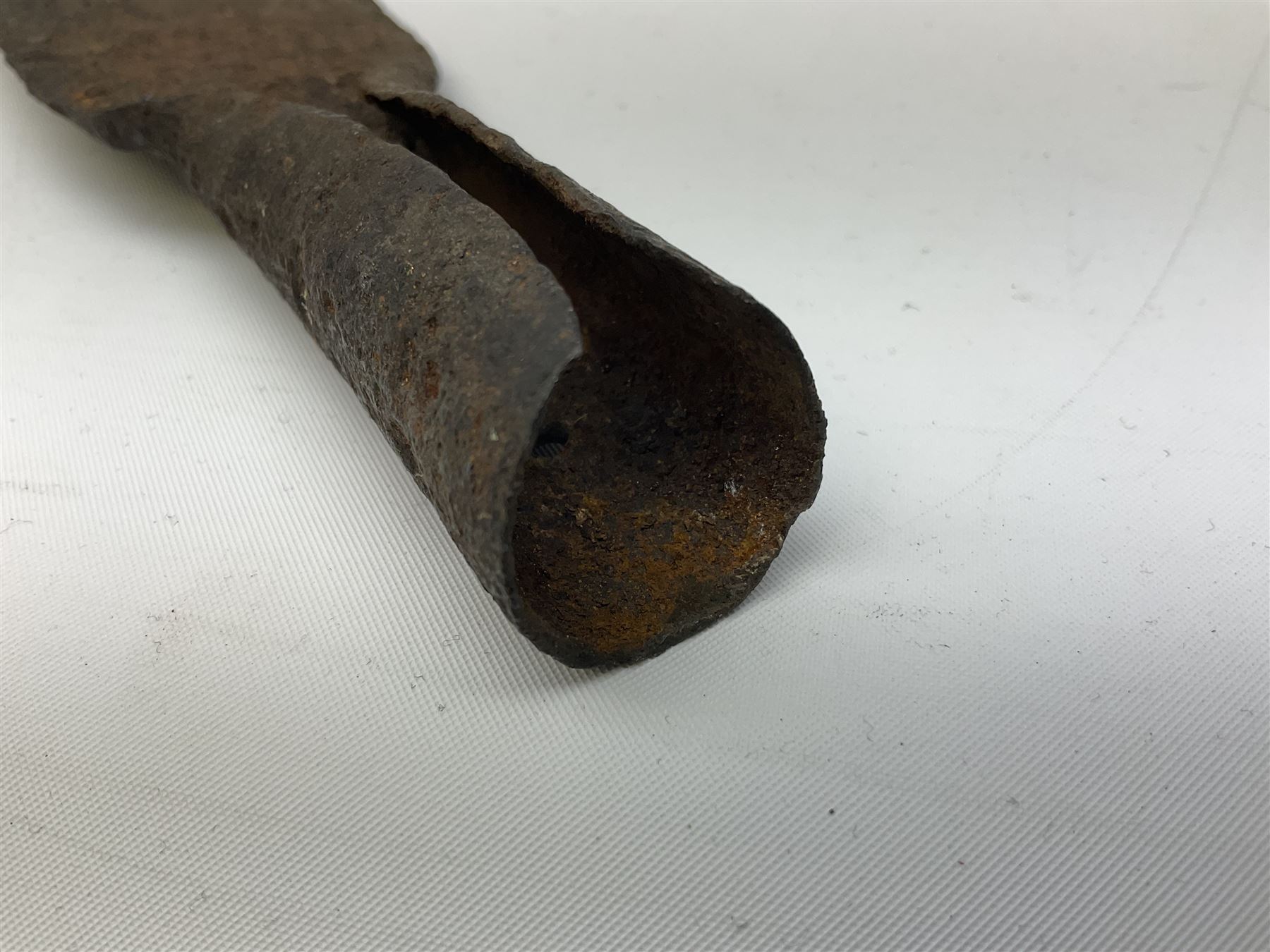 Patinated 'bronze' fantasy dagger, the 26cm blade, hilt and scabbard cast with dragons L50cm overall; hand forged iron spearhead L29.5cm; and a stiletto blade (3)