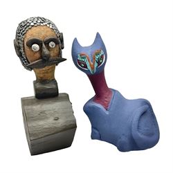 Helen Skelton (British 1933 – 2023): Two carved wooden abstract sculptures, one modelled as a cat, painted in bright colours, the other modelled as a man, with applied features and nail hair, largest H53cm. Born into an RAF family in 1933 in Kent and travelled the world extensively during her childhood. After settling in Bridlington, Helen immersed herself in painting, textiles, and wood sculpture, often inspired by nature's beauty. Her talent was showcased in a one-woman show at Sewerby Hall and recognised with the sculpture prize at Ferens Art Gallery in 2000. Sadly, Helen’s daughter passed away from cancer in 2005. This loss inspired Helen to donate her sculptures to Marie Curie upon her passing in 2023.