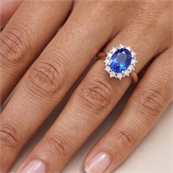 18ct rose gold sapphire and diamond cluster ring, single oval cut sapphire of approx 1.25 carat, with round brilliant cut diamond surround, hallmarked, total diamond weight approx 0.25 carat