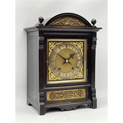 German Winterhalder and Hoffmeier quarter striking mantle clock in an ebonised arts and crafts case c1890, square brass dial with a matted centre, spandrels and silvered chapter ring, Roman numerals and Arabic five-minute numerals, half-hour markers and minute track, steel halberd hands within a glazed door, eight-day rack striking movement sounding the quarters and hours on two coiled gongs.


