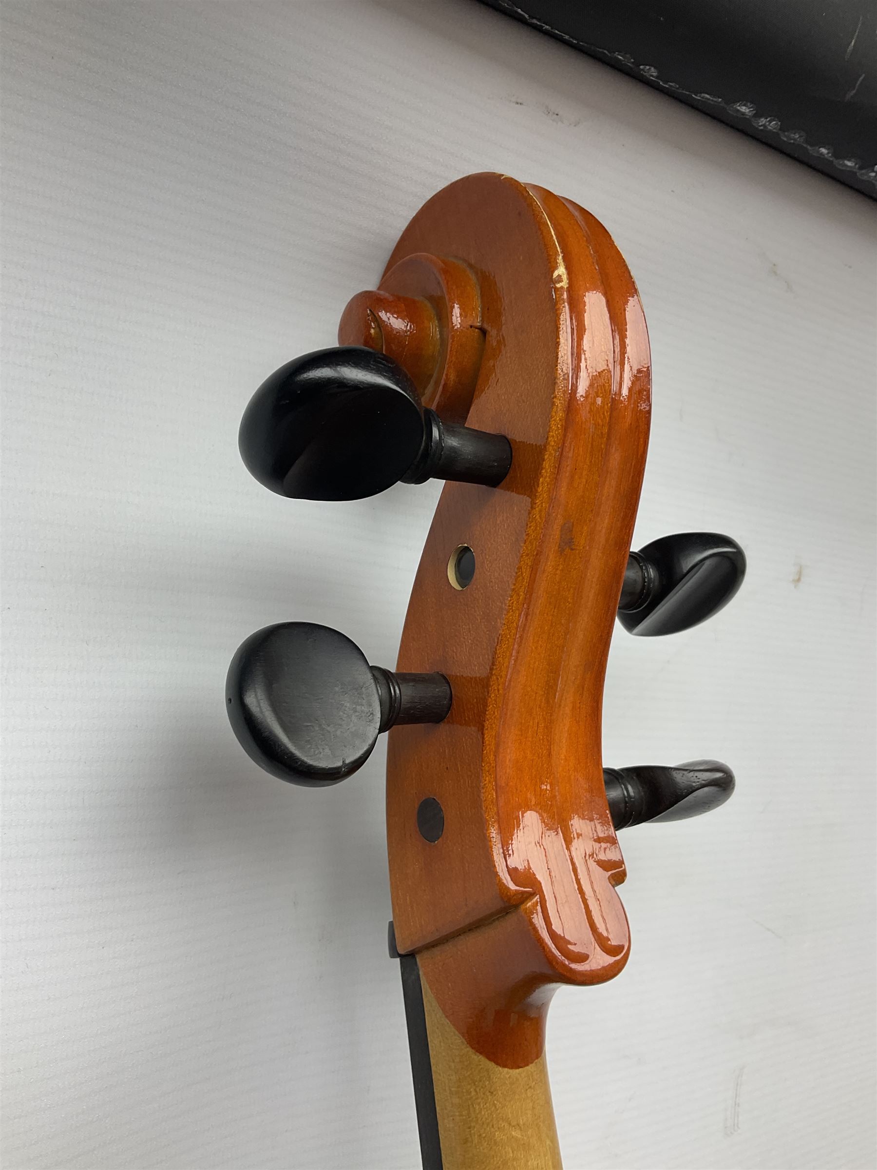 Modern Hungarian half-size cello with 69cm two-piece maple back and ribs and spruce top L114cm overall; and Stentor half size cello bearing label 'The Stentor Student II'; each in soft carrying case (2)