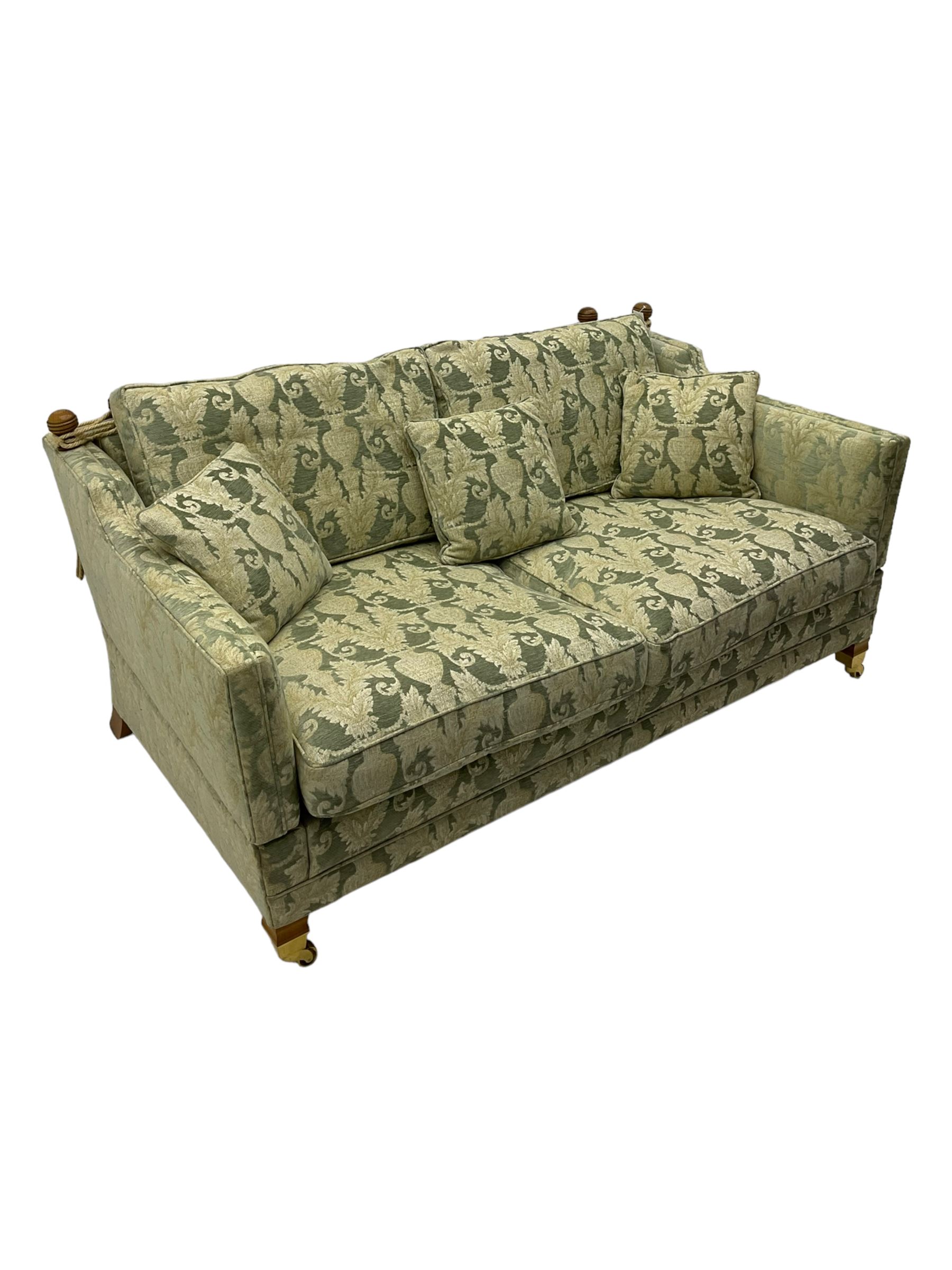 Three-piece hardwood-framed lounge suite - large two-seat Knole sofa with drop ends, upholstered in patterned fabric decorated with urns and foliage (W190cm, D117cm, H88cm); armchair upholstered in contrasting geometric pattern fabric (W83cm, D102cm, H93cm); and another armchair (W82cm, D102cm, H92cm) (3)