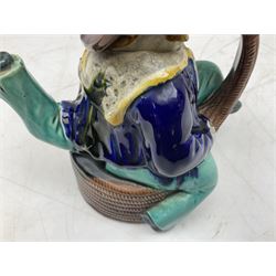 Majolica teapot and cover in the form of an Isle of Man 'Manx Sailor', a three-legged sailor seated on a barrel, H25cm