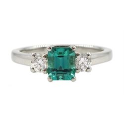 Platinum three stone fine emerald and diamond ring, hallmarked 
