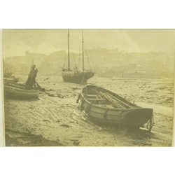  Early 20th century monochrome photograph of fishing boats in Whitby Harbour at low tide, 27cm x 38cm   