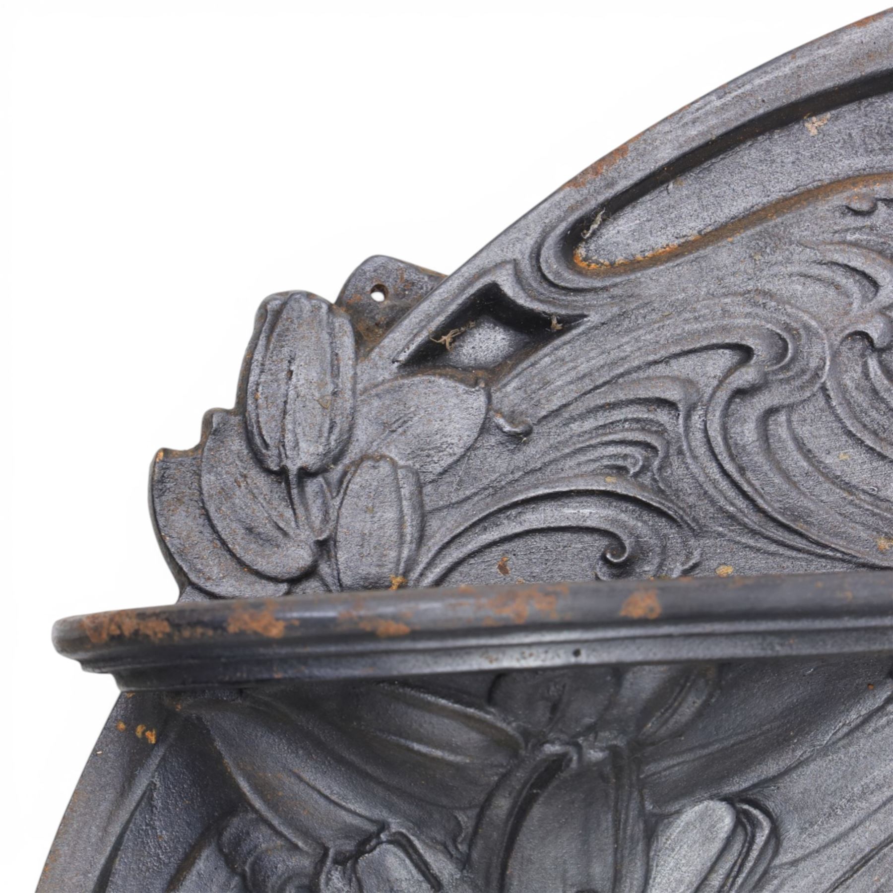 Art Nouveau cast iron fireplace, shaped hood with scrolling foliate crest, relief cast panel of female figure seated within shell form amidst wave motifs, uprights cast with foliate designs