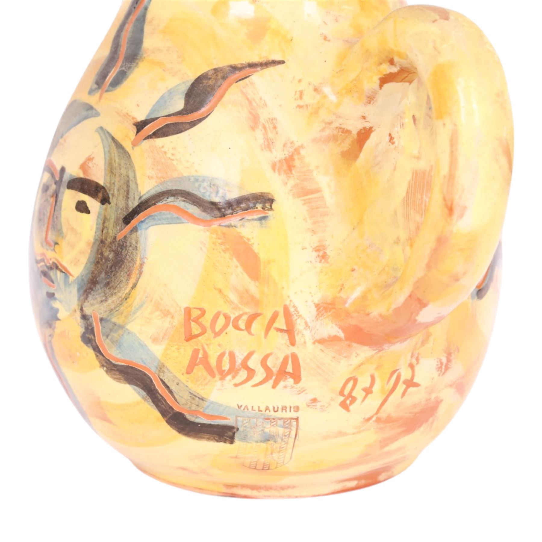 Vallauris French pottery by Patrick Bocca Rossa, jug painted with sun motifs upon a yellow ground, and an octagonal plate with a face to the center, both signed, jug H22cm 