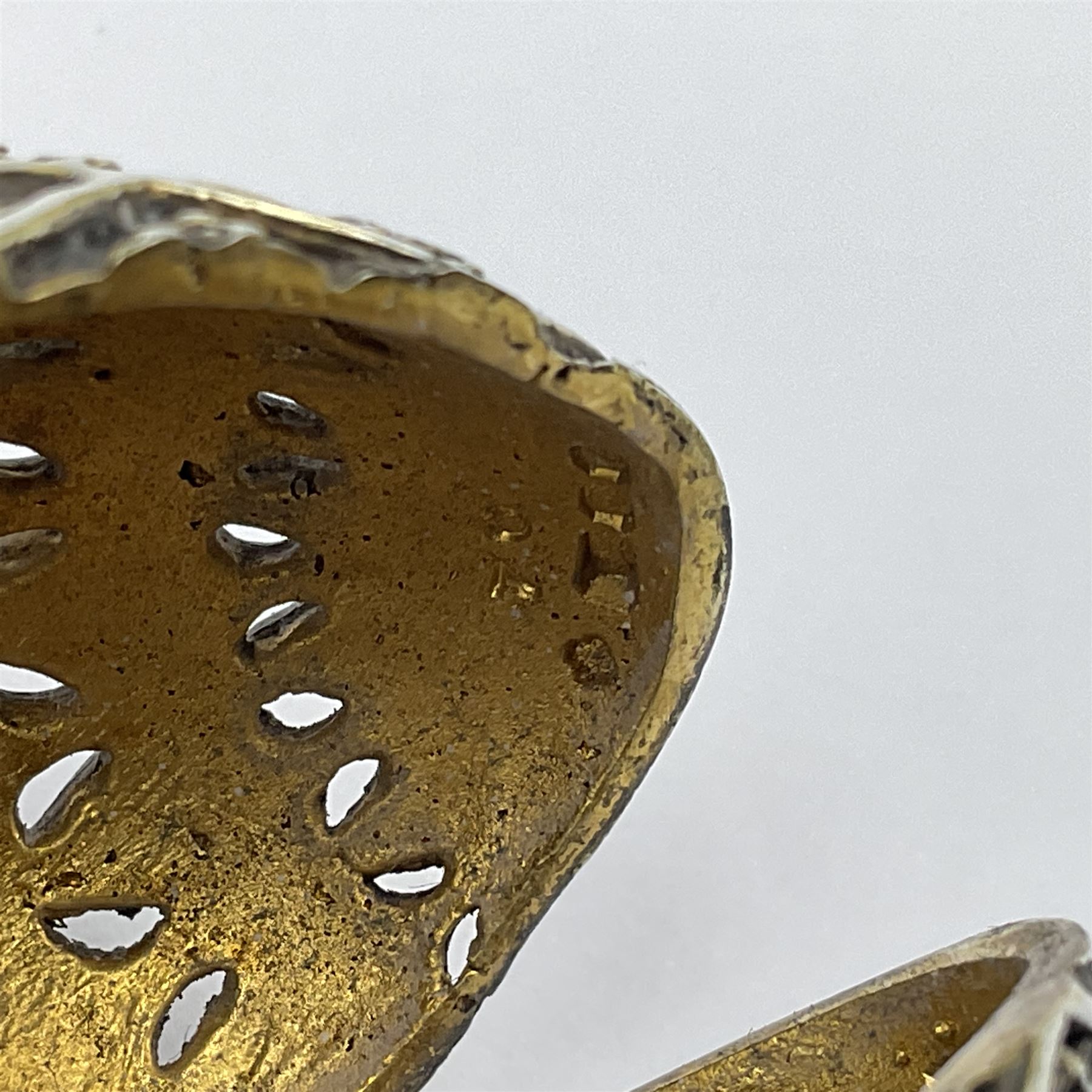 Modern silver limited edition Easter egg, no. 70/500, the openwork lattice body decorated with gilded panels of flower heads, opening to reveal a gilt interior, upon silver stand with three scrolling pad feet, each hallmarked St James House Company, London 1979, height including stand 8cm