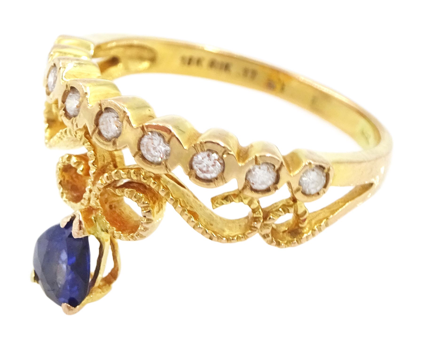18ct gold pear cut sapphire and nine stone round brilliant cut diamond openwork ring, stamped 750