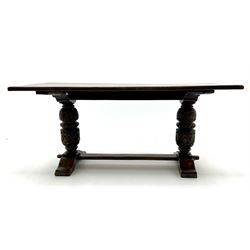 Rectangular oak refectory dining table, shell carved cup and cover supports joined by pegged stretcher and shaped feet 